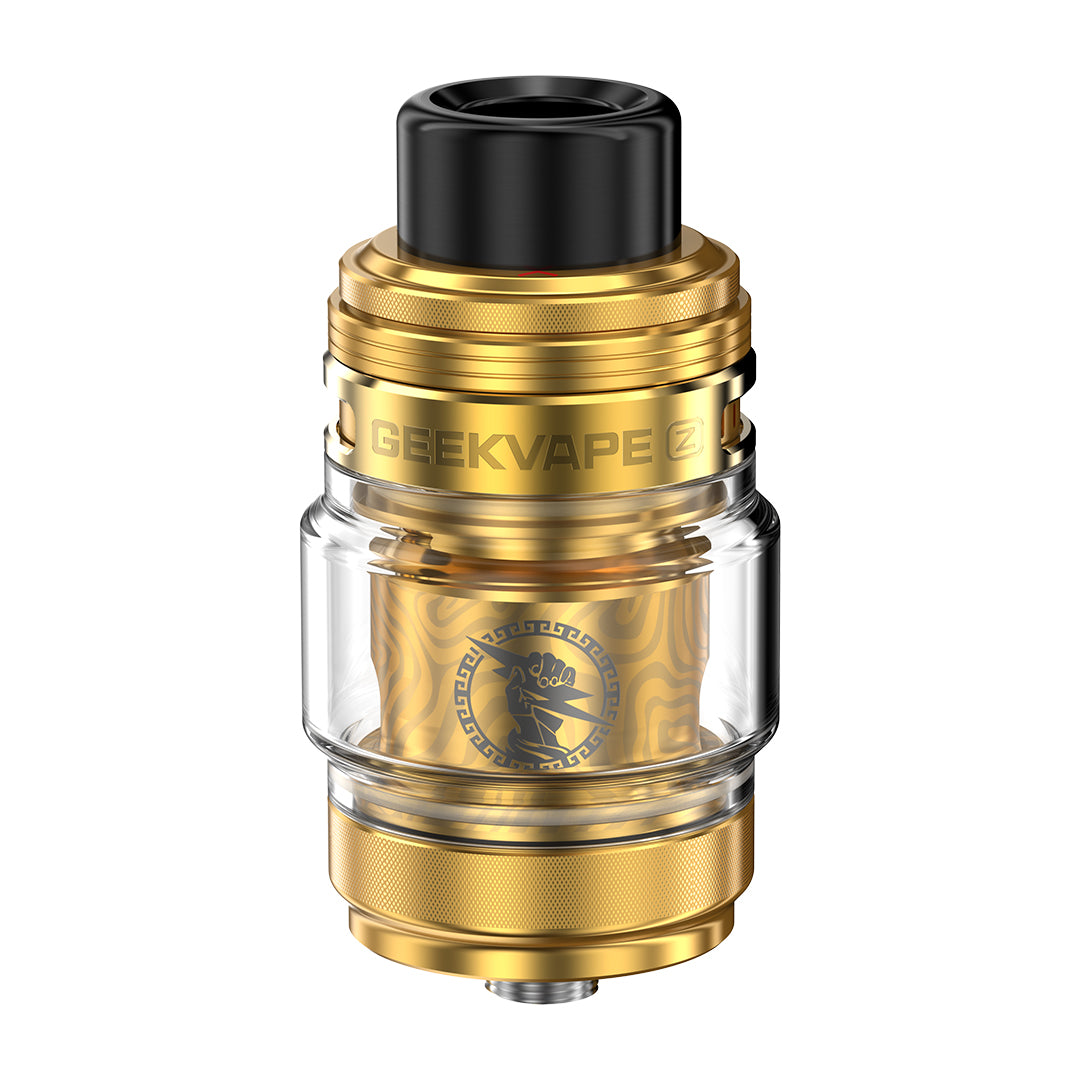 Gold and clear vaping device with black top on a white background